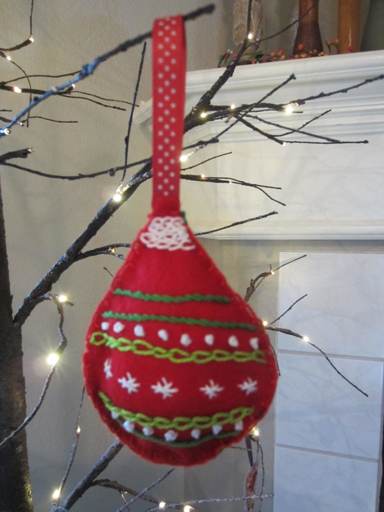 The finished retro embroidered felt ornament