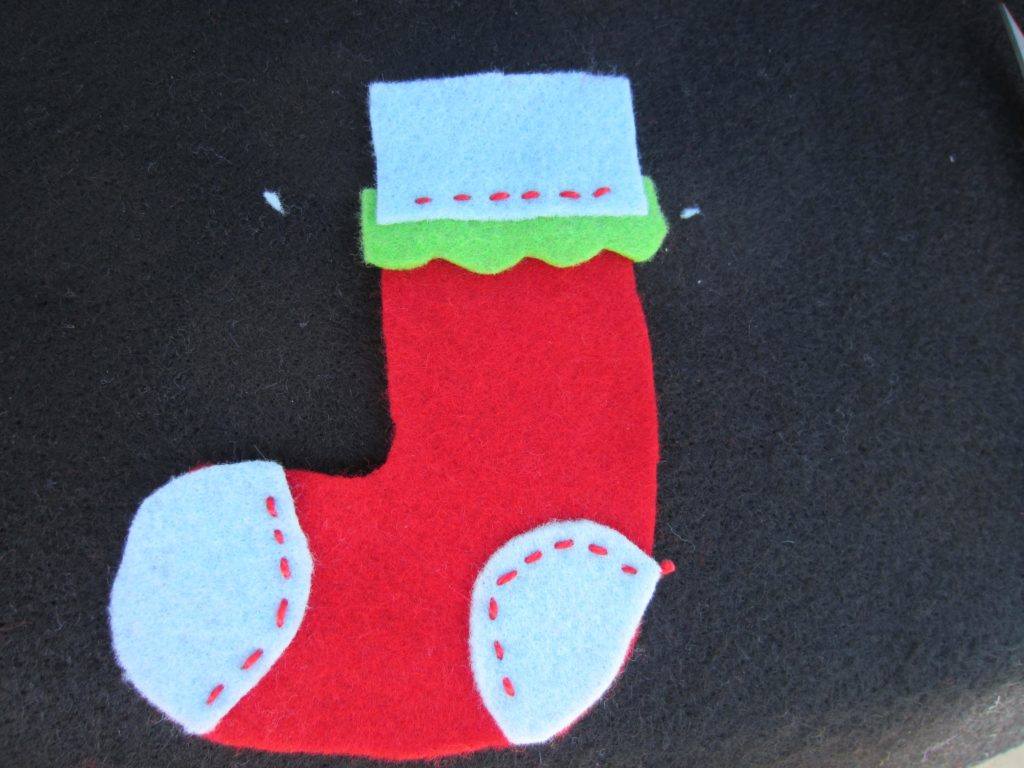 Sew the pieces with a basic running stitch to the base