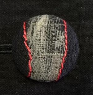 Combined techniques - discharge and red stitching