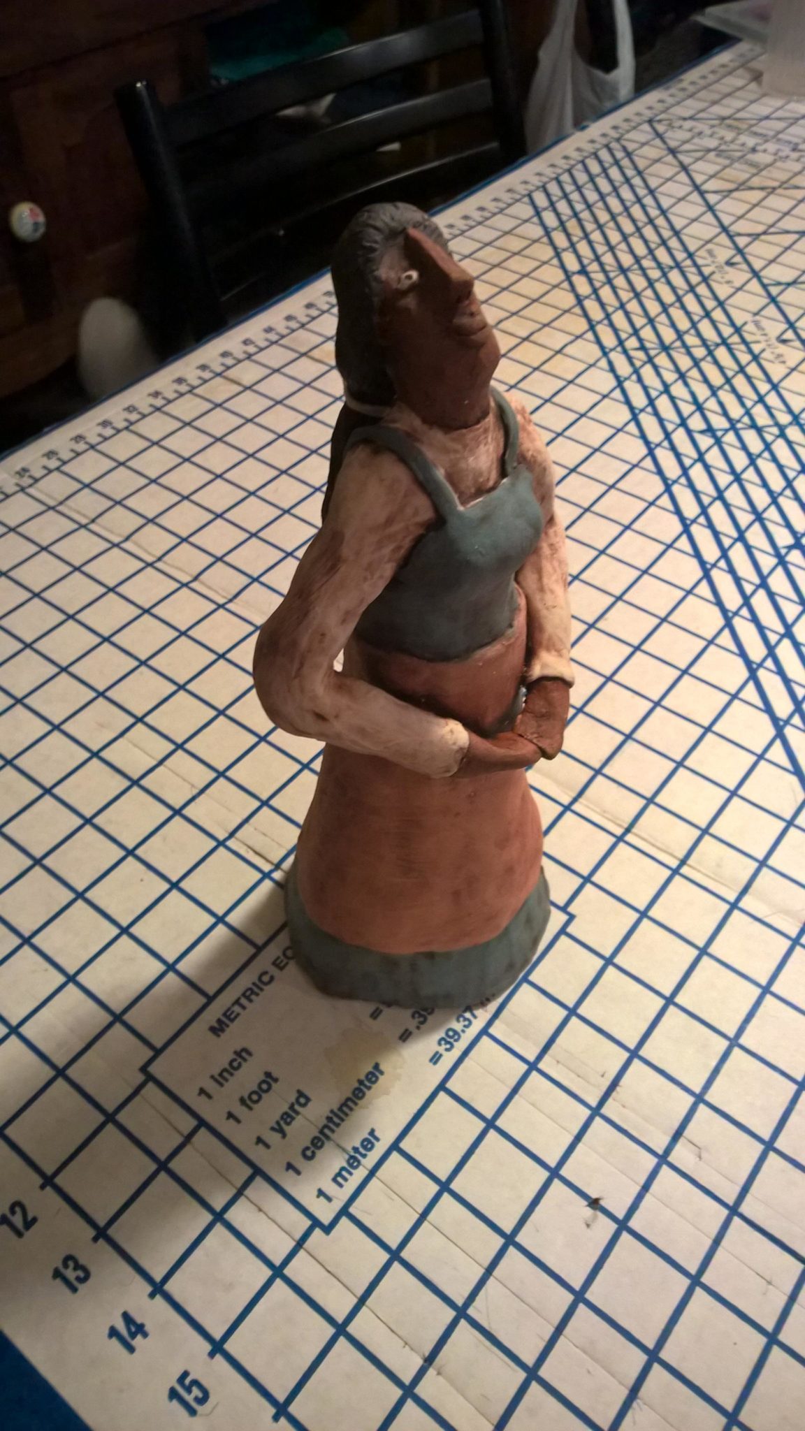 Coned figure sculpture