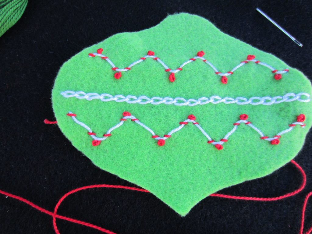 All of the French knots are added to the Laced Whipping Stitch