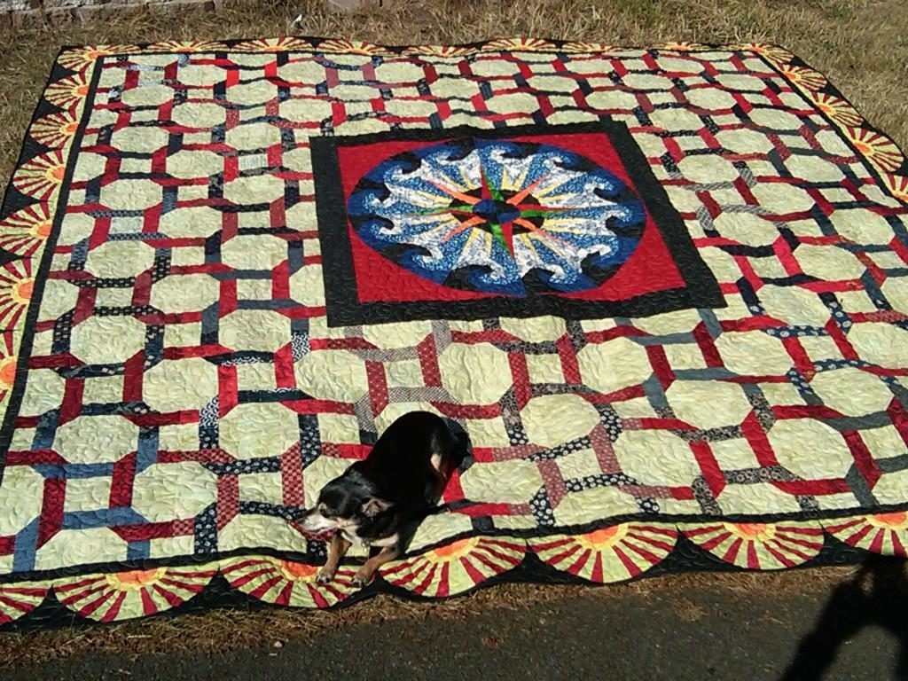 Finished quilt: Mariner’s Compass Graduation Quilt with Fan Border