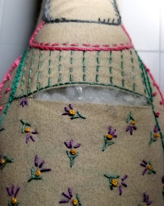 Ruth with her back seam open for filling the embroidered forest friend