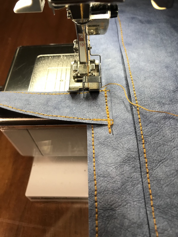 Stitching the handles on the tote