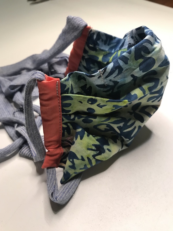 Side view of pleated face mask