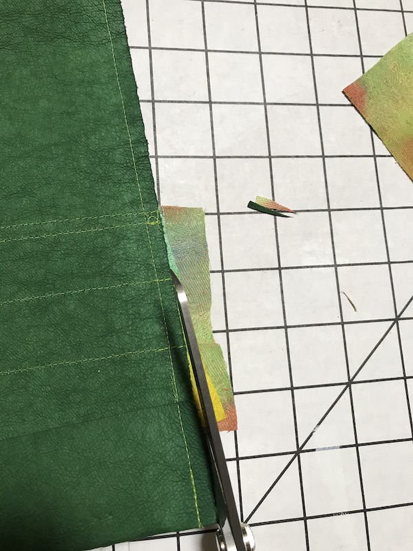 Trimming up the bottom of the pen quiver to be even with the Kraft-Tex