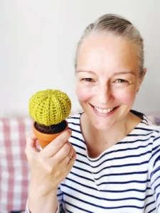Emma Varnam with a crocheted cactus