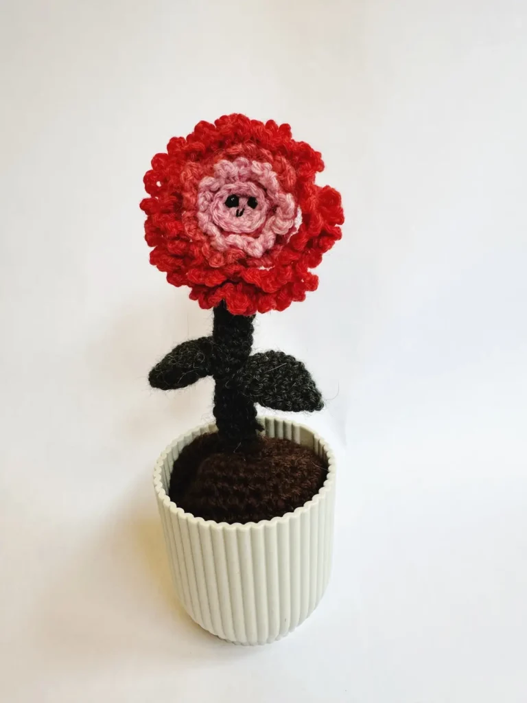 Pink flower crocheted by Emma Varnam