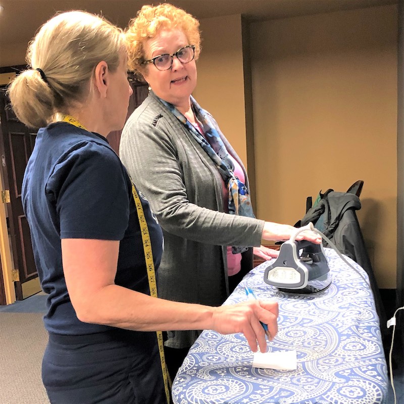 Showing proper height for standing at the ironing board