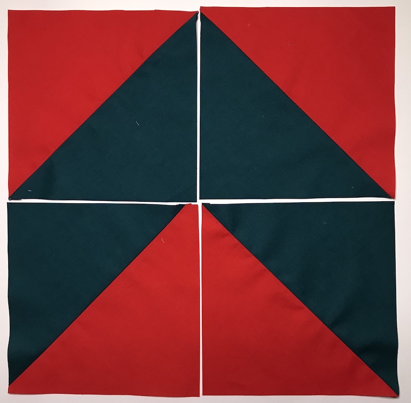 Half square triangles four at a time from a layer cake layout 1