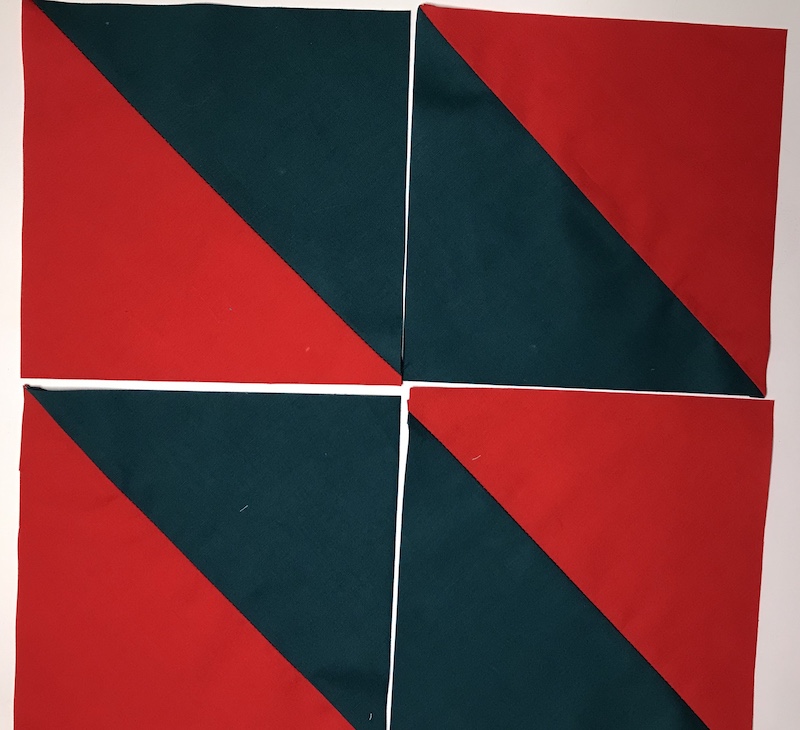 Half square triangles four at a time from a layer cake layout 2
