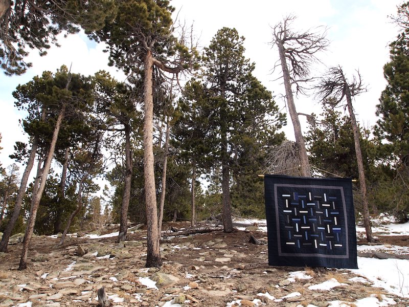 Blue quilt hung in nature