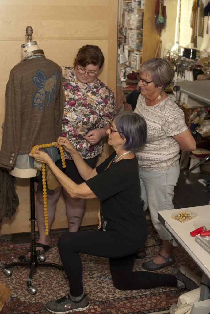 Marta, Mary and Alleya designing a garment