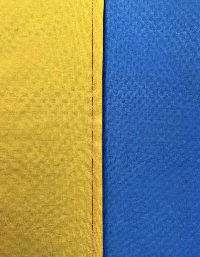 French seam finished inside in blue and yellow