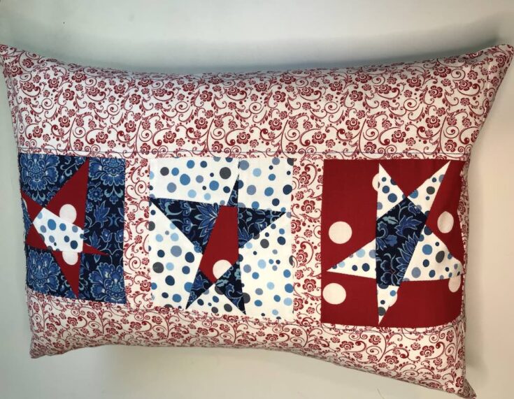 "Wonky Star Pillow Cover” is a Free Quilted Pillow Pattern designed by Lynn Woll from Create Whimsy!