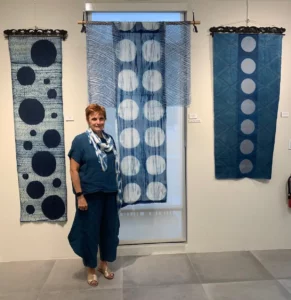 Suzanne Connors with some pieces hanging