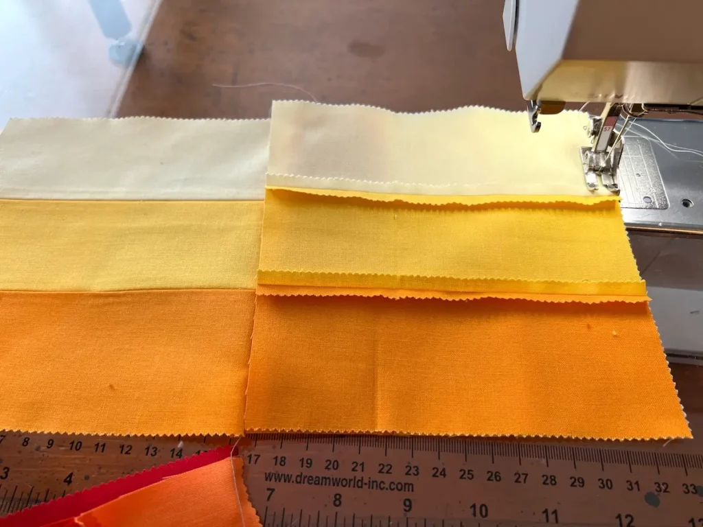 Sewing the columns together for the rail fence quilt