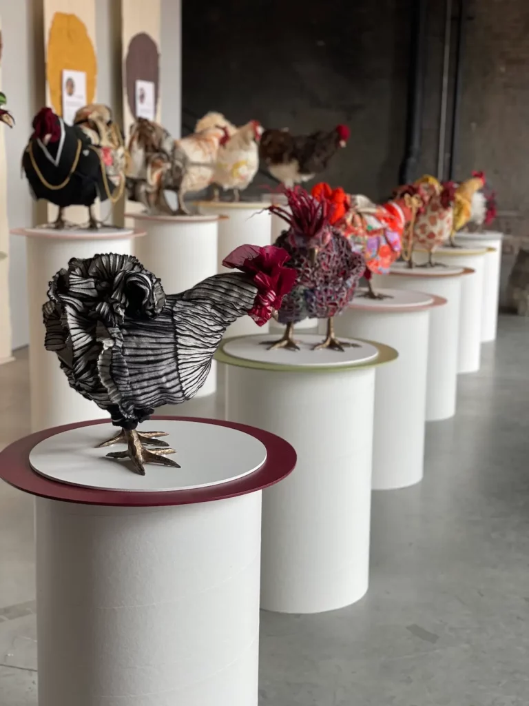 Chickens on display in a gallery