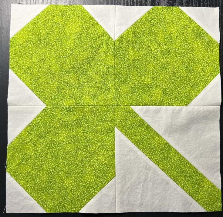 "Shamrock” is a Free St. Patrick's Day Quilt Block Pattern designed by Lynn Woll from Create Whimsy!