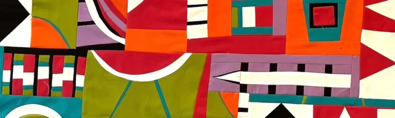 Finished top of improv quilt by Lynn Woll