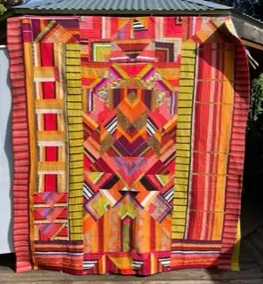 Modern quilt in yellows and oranges by Robin Oneil