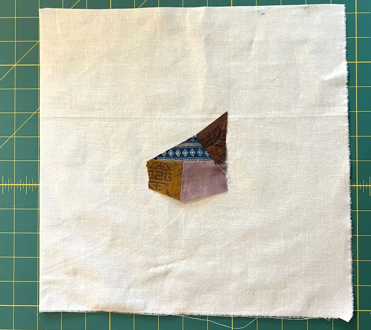 The first four pieces on the foundation muslin for the crazy quilt block