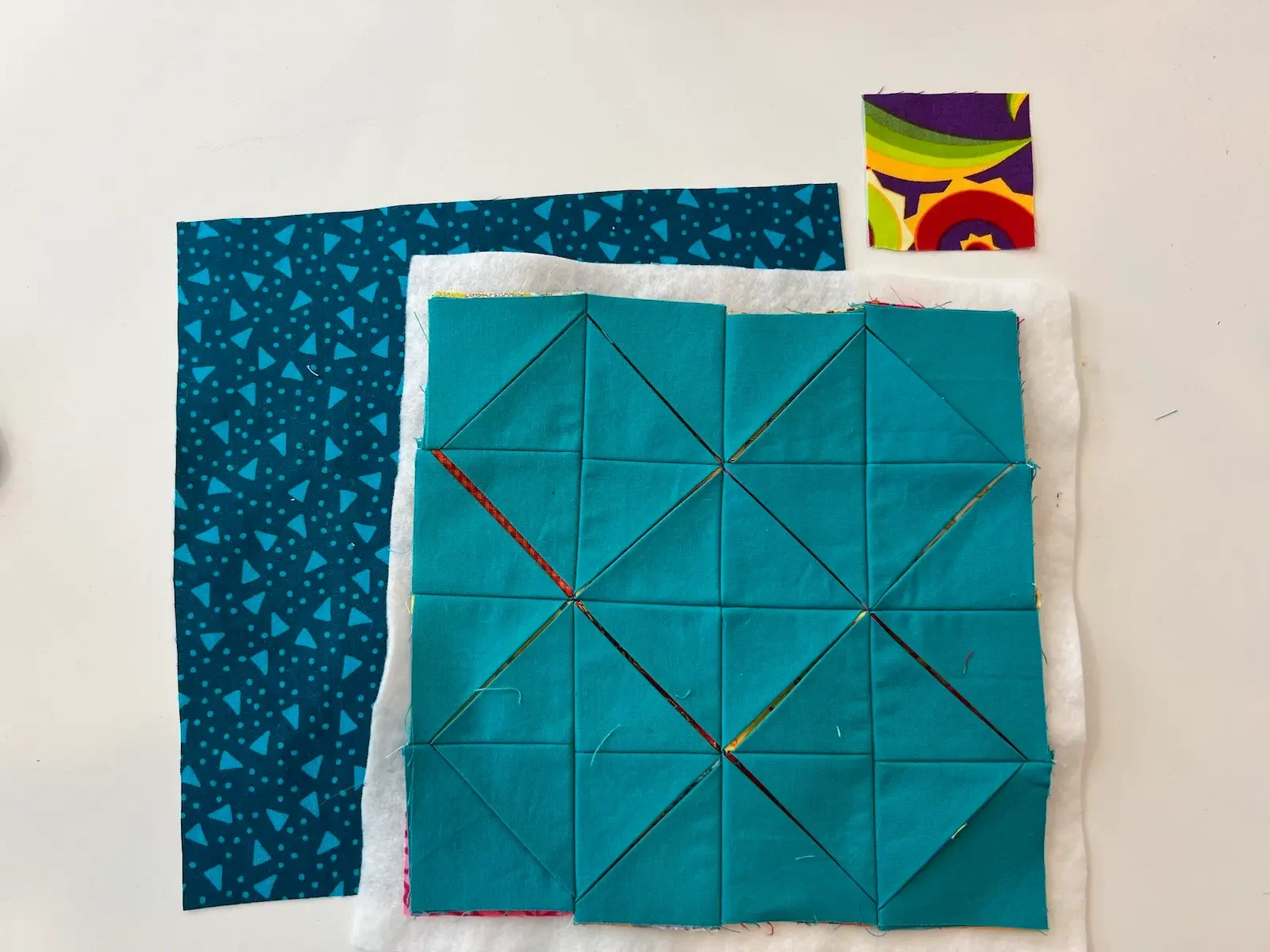 Easy Cathedral window quilt cut batting, backing, and additional windows