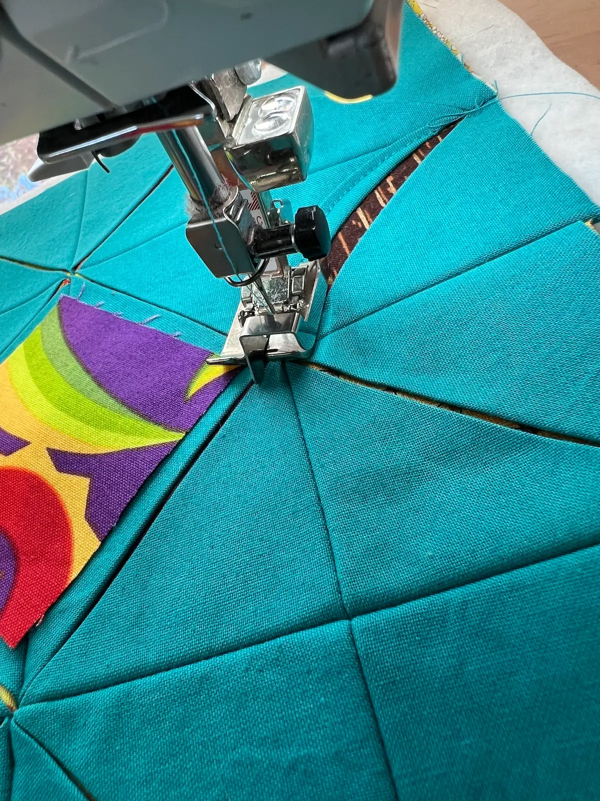 Easy Cathedral window quilt begin stitching at one of the long diagonals