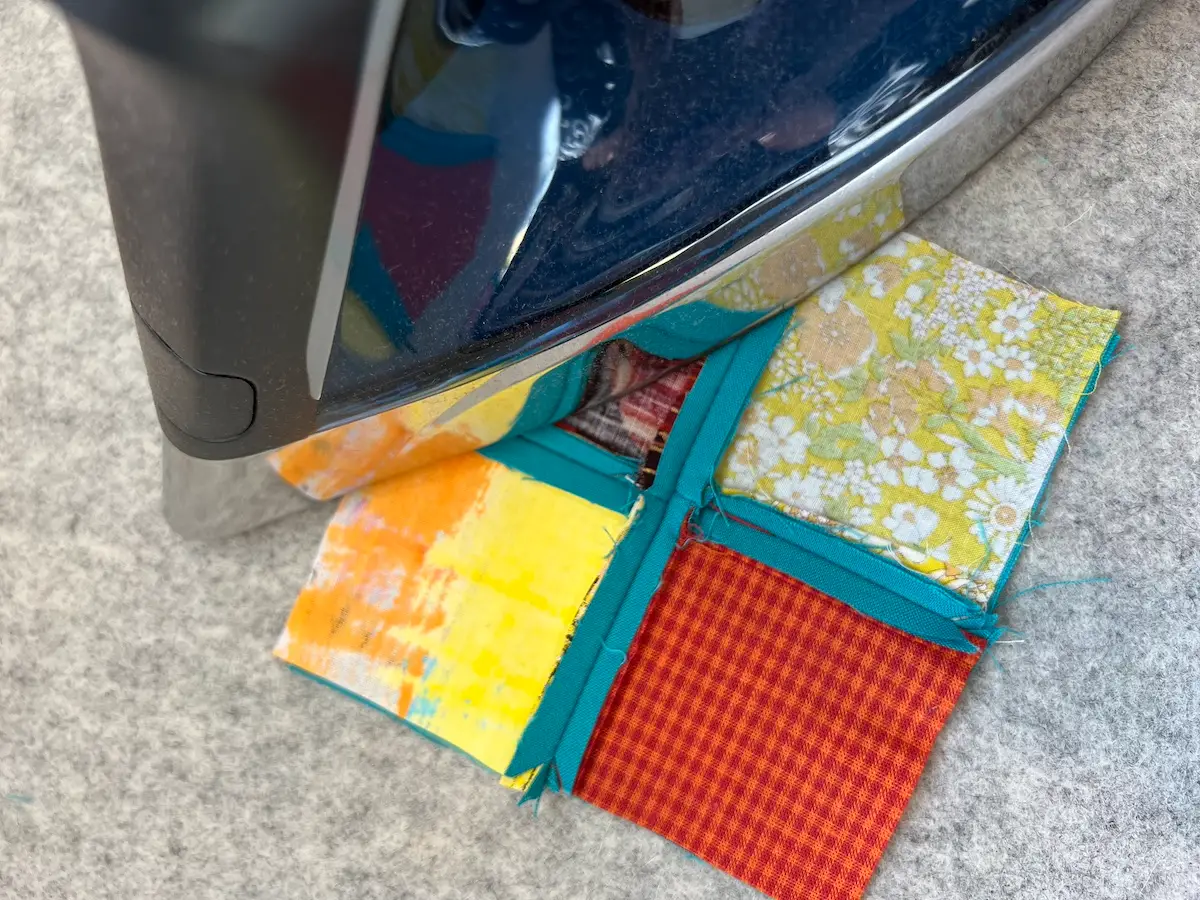 Easy Cathedral window quilt press the seams open on the 4 patches