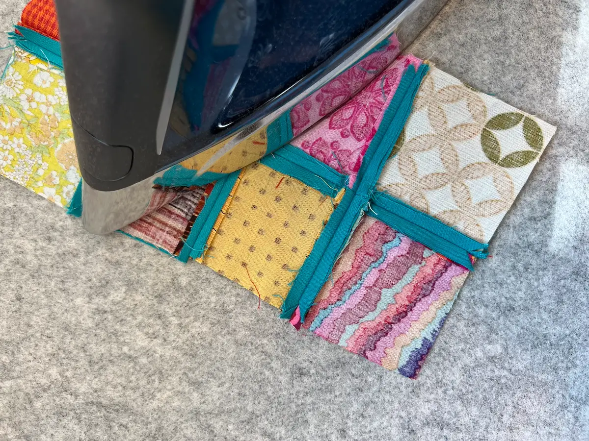Easy Cathedral window quilt rows sewn together and press the seams open