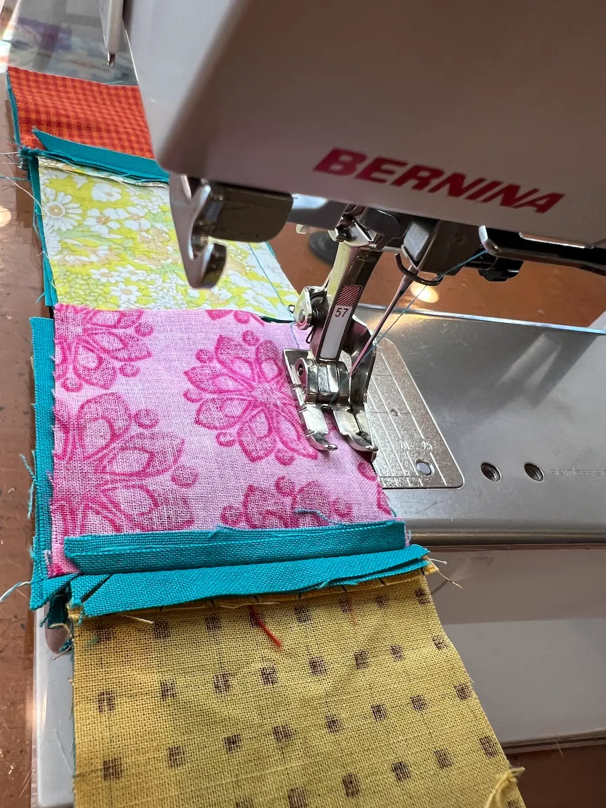 Easy Cathedral window quilt again sew the 4 patches in a chain to make it faster