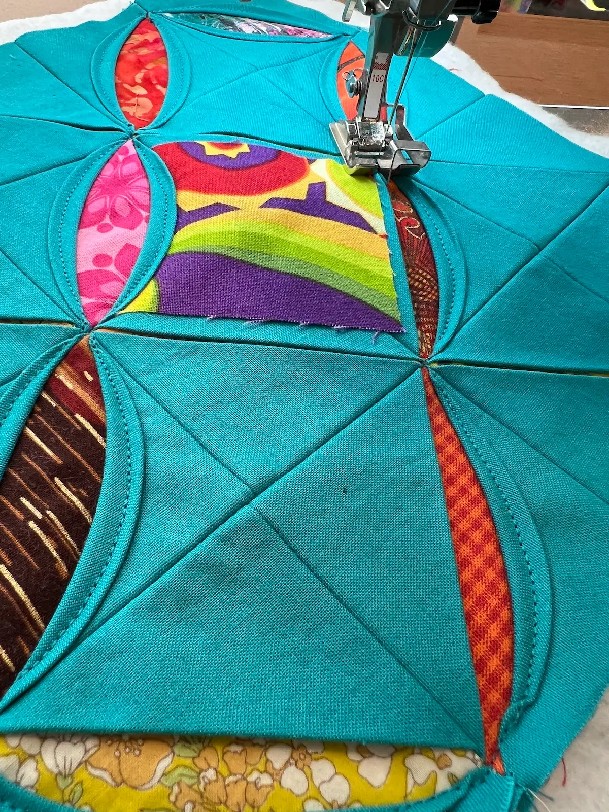 Easy Cathedral window quilt When you get to an outside window, stop and prepare the fold to make sure that the raw edge is covered