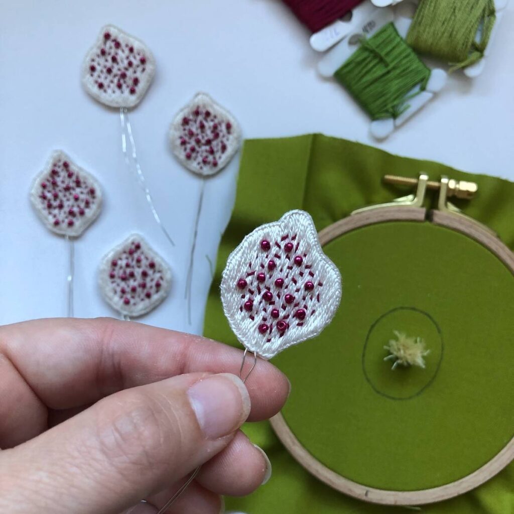 Showing a stumpwork flower in progress by Melissa Galbraith