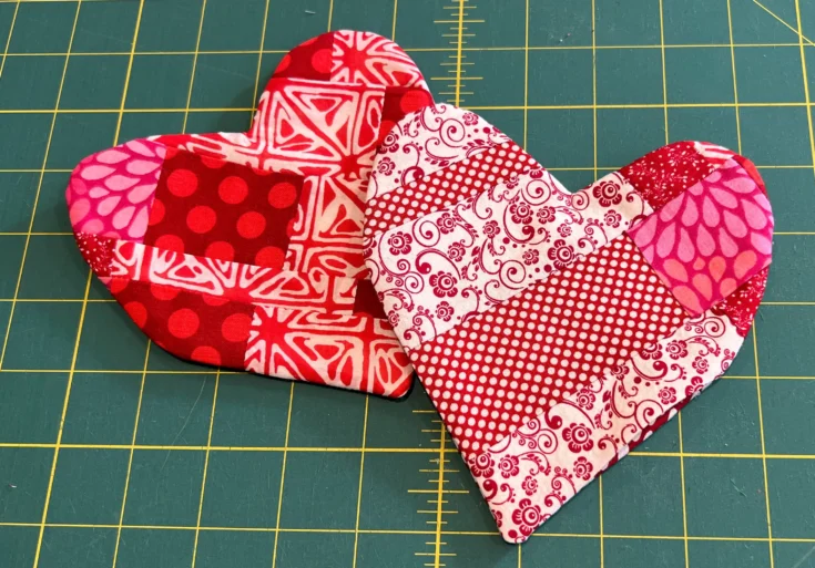 "Scrappy Heart” is a Free Valentine's Day Quilted Mug Rug Pattern designed by Lynn Woll from Create Whimsy!