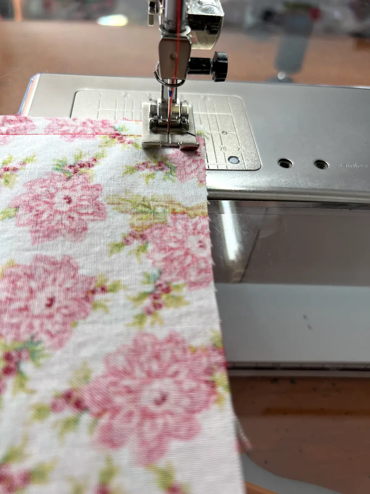 Keep needle down to turn the corner for the reversible fabric napkin