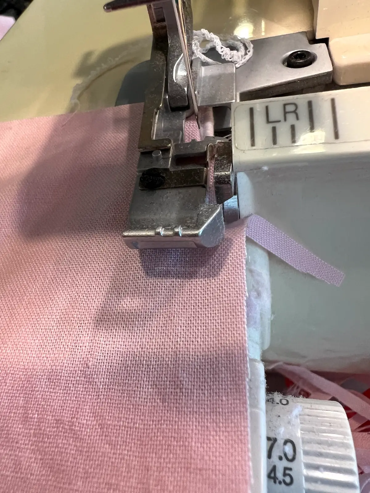 Serge along the edge of the napkin using the rolled edge settings
