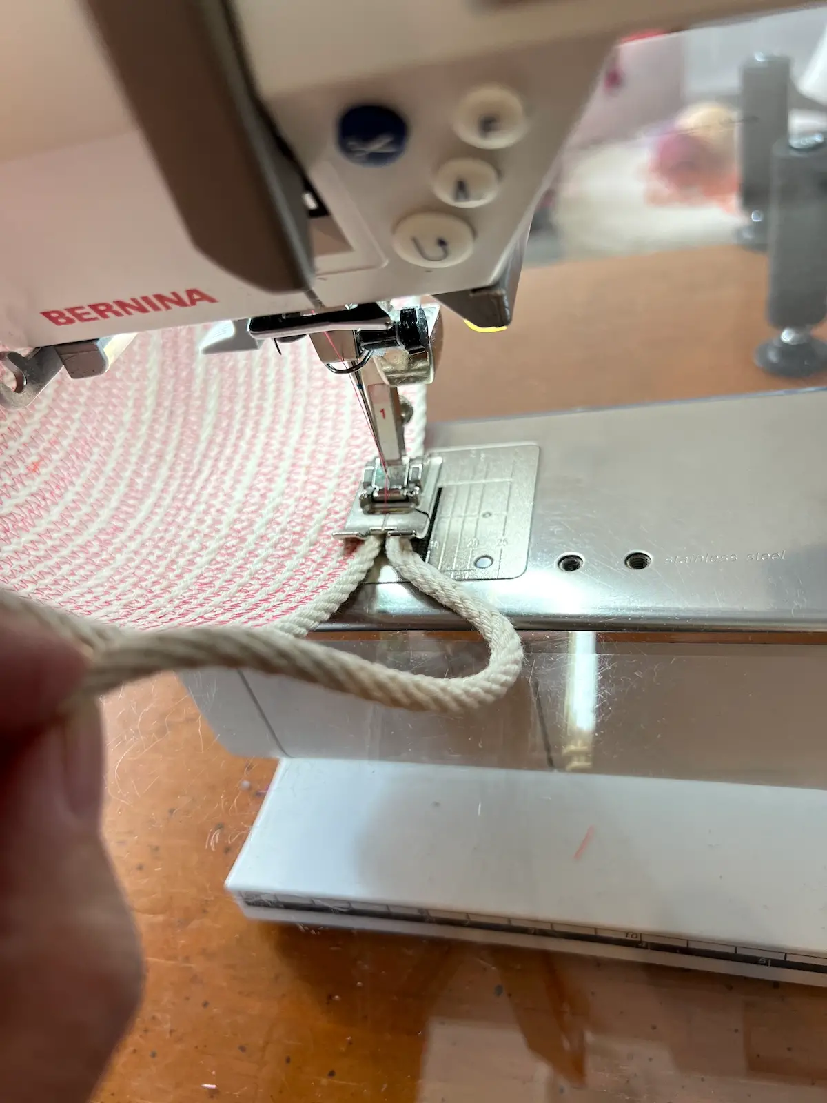 Beginning to form the rope handle on a rope basket