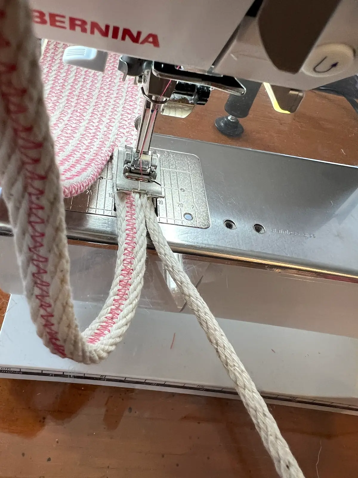 Adding a third layer of rope to the handle on the rope basket