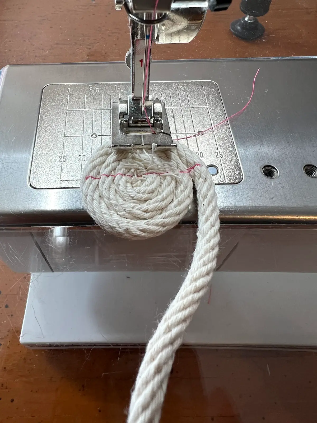 Beginning to start the center of the base of the pink rope basket