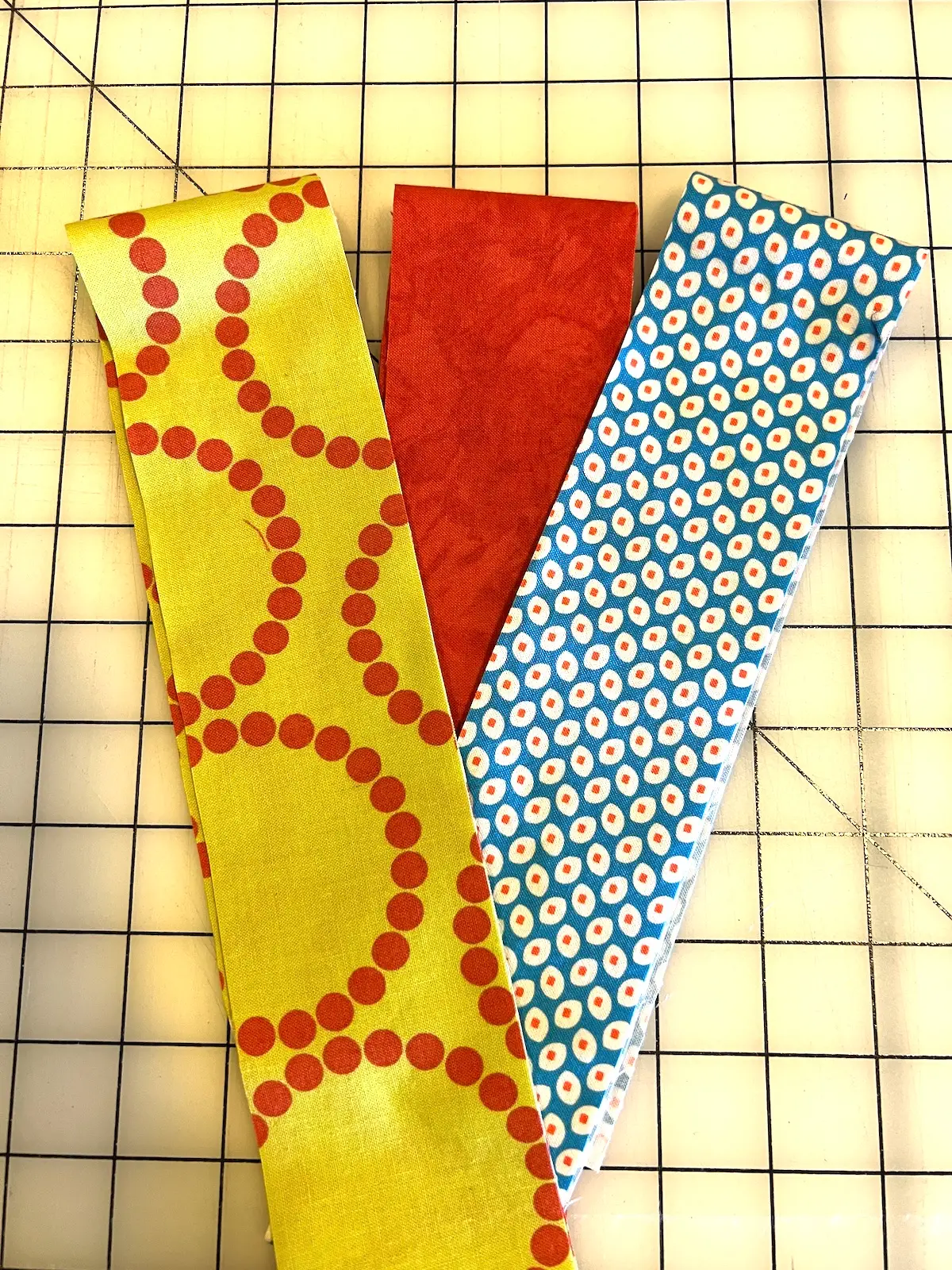 Three fabrics selected to make the 7 weave patch quilt