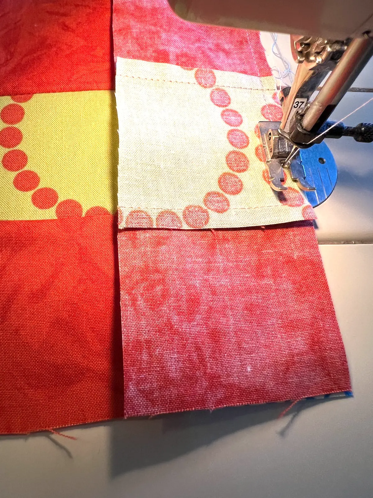 Sewing the blocks together for the 7 weave patch quilt block