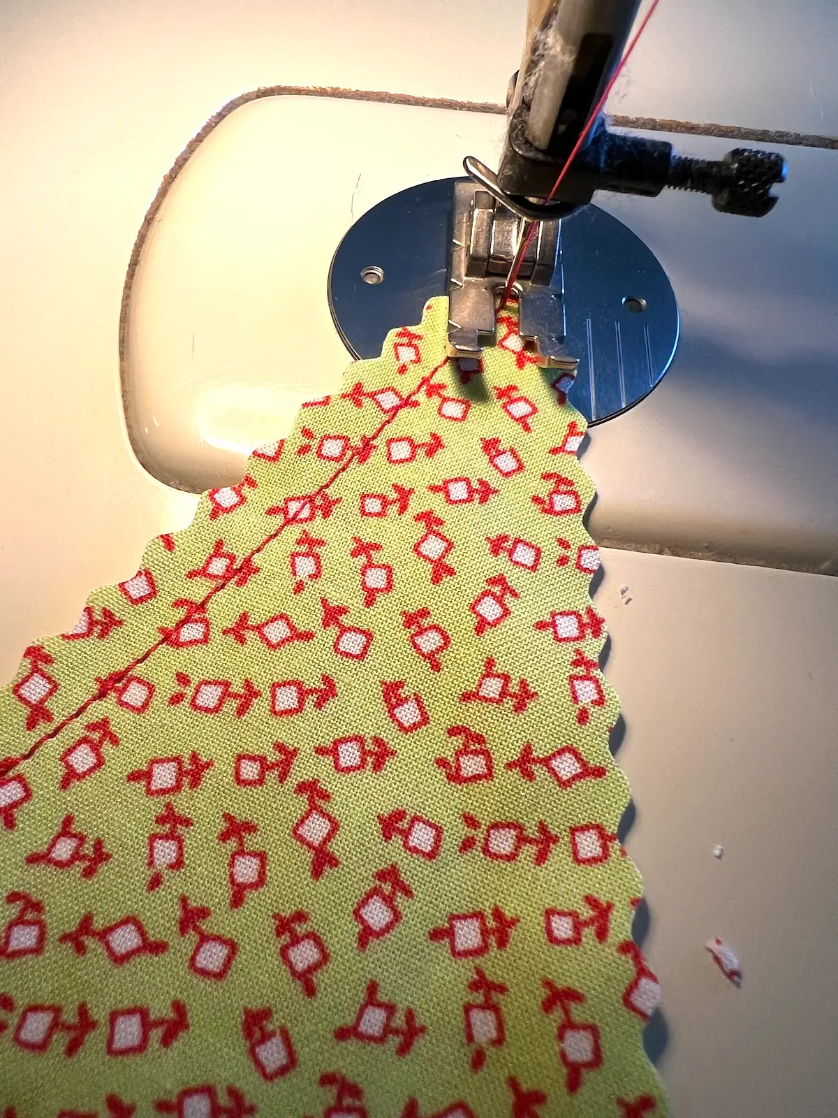 Turn and sew down the other side of the tree for the christmas tree ornament