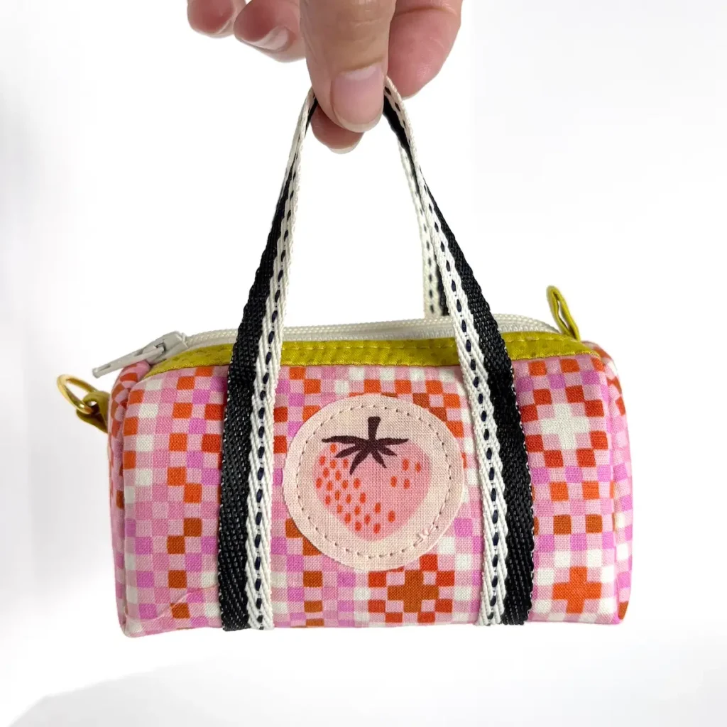 Tiny Duffle made in strawberry fabric by Diana Fitzgerald