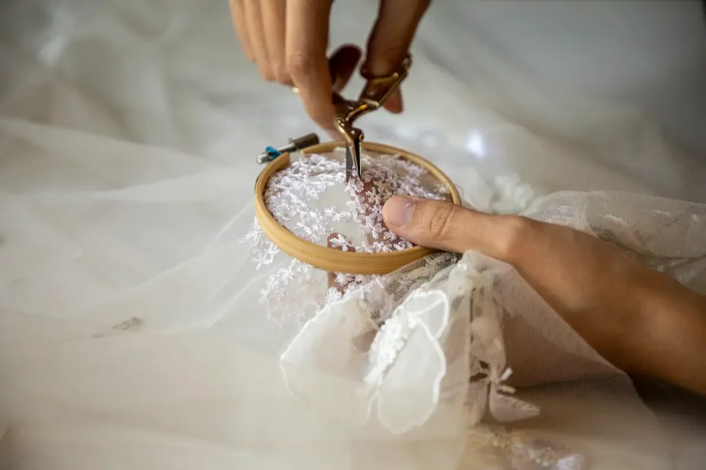 Isa Guadalupe Medina hand stitching photo by Braulio Lam