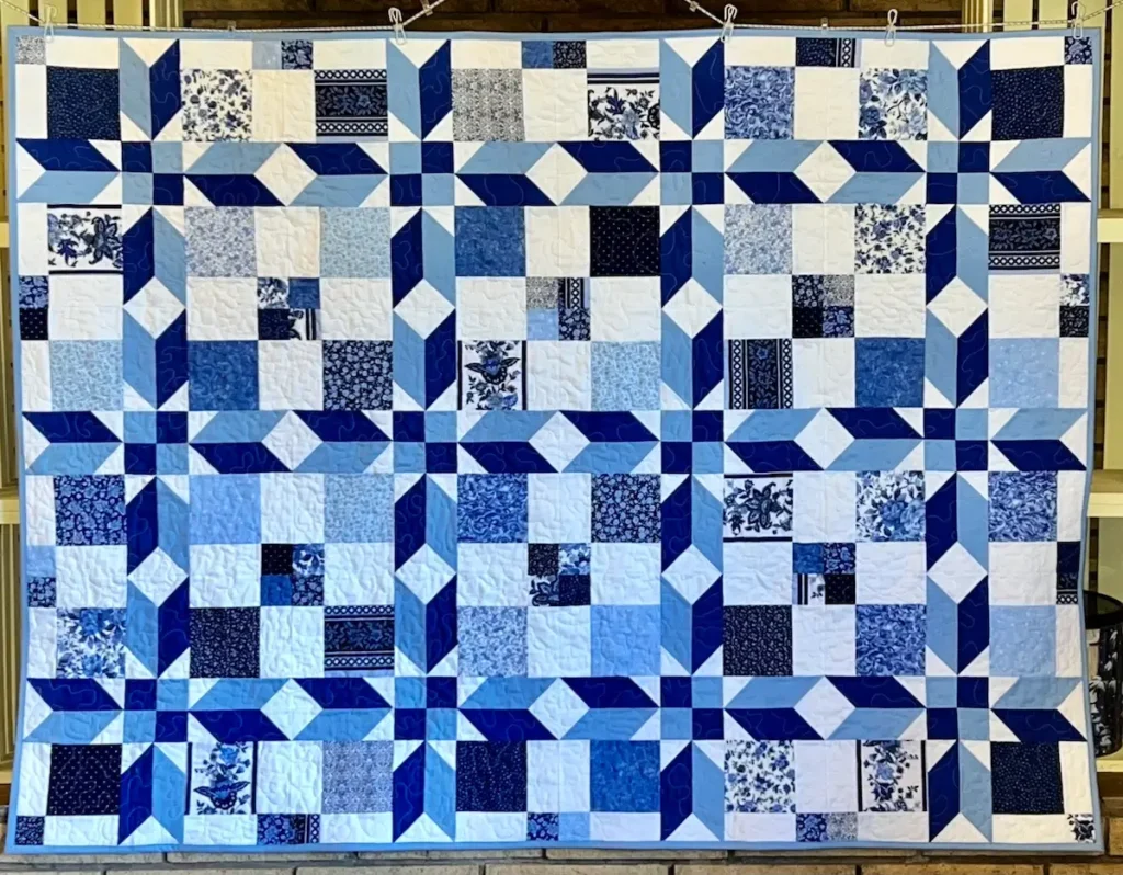 Blue and white star quilt by Monique Arnold