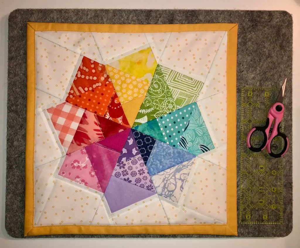 Small bright quilt by Monique Arnold