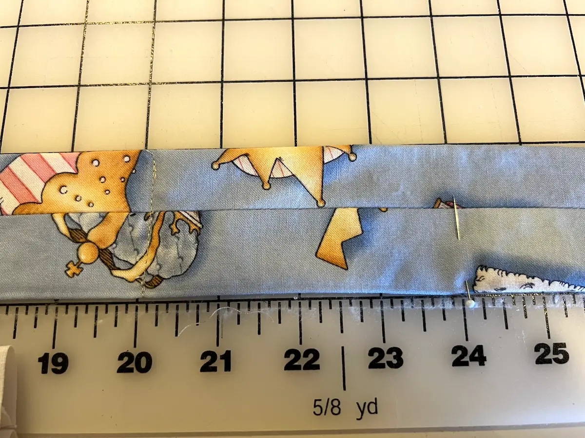 After putting in an eighth of a teaspoon of the water beads mark four inches from where you sewed before