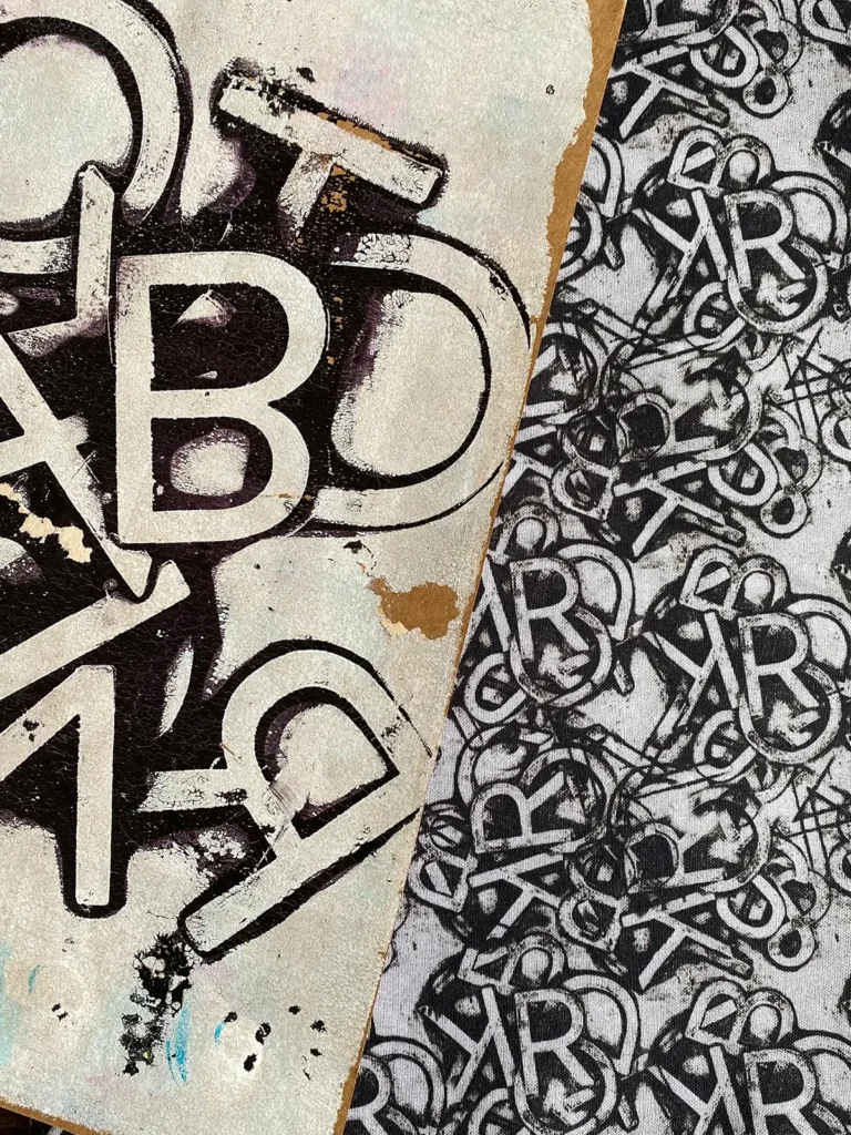 Letters painted in black on white by e bond