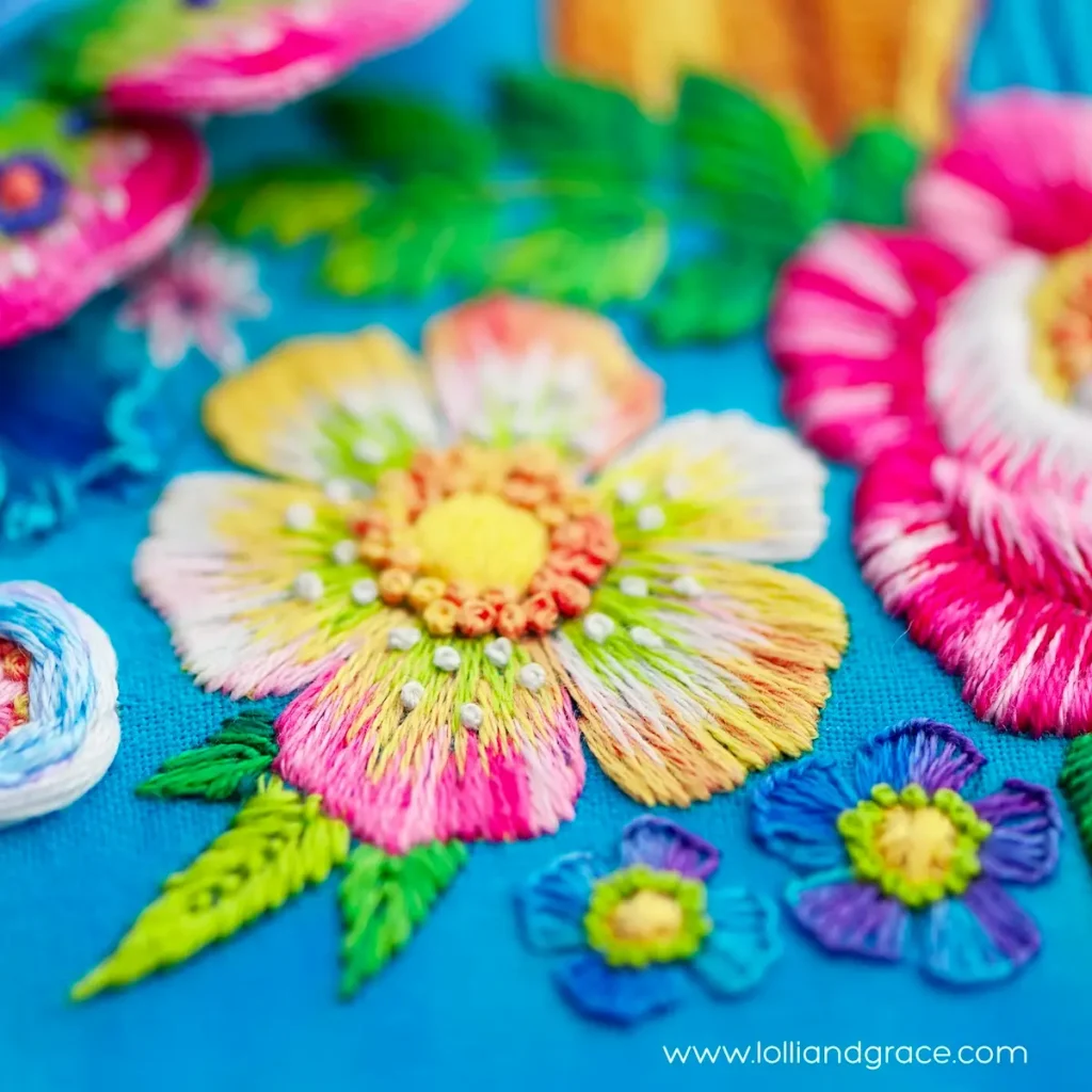 Bright flower embroidery with french knots by Anne Oliver