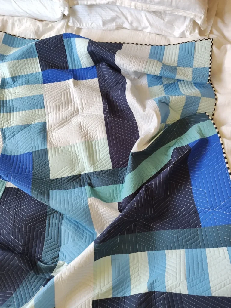 Variety of blues in a quilt by Ashelyn Downs